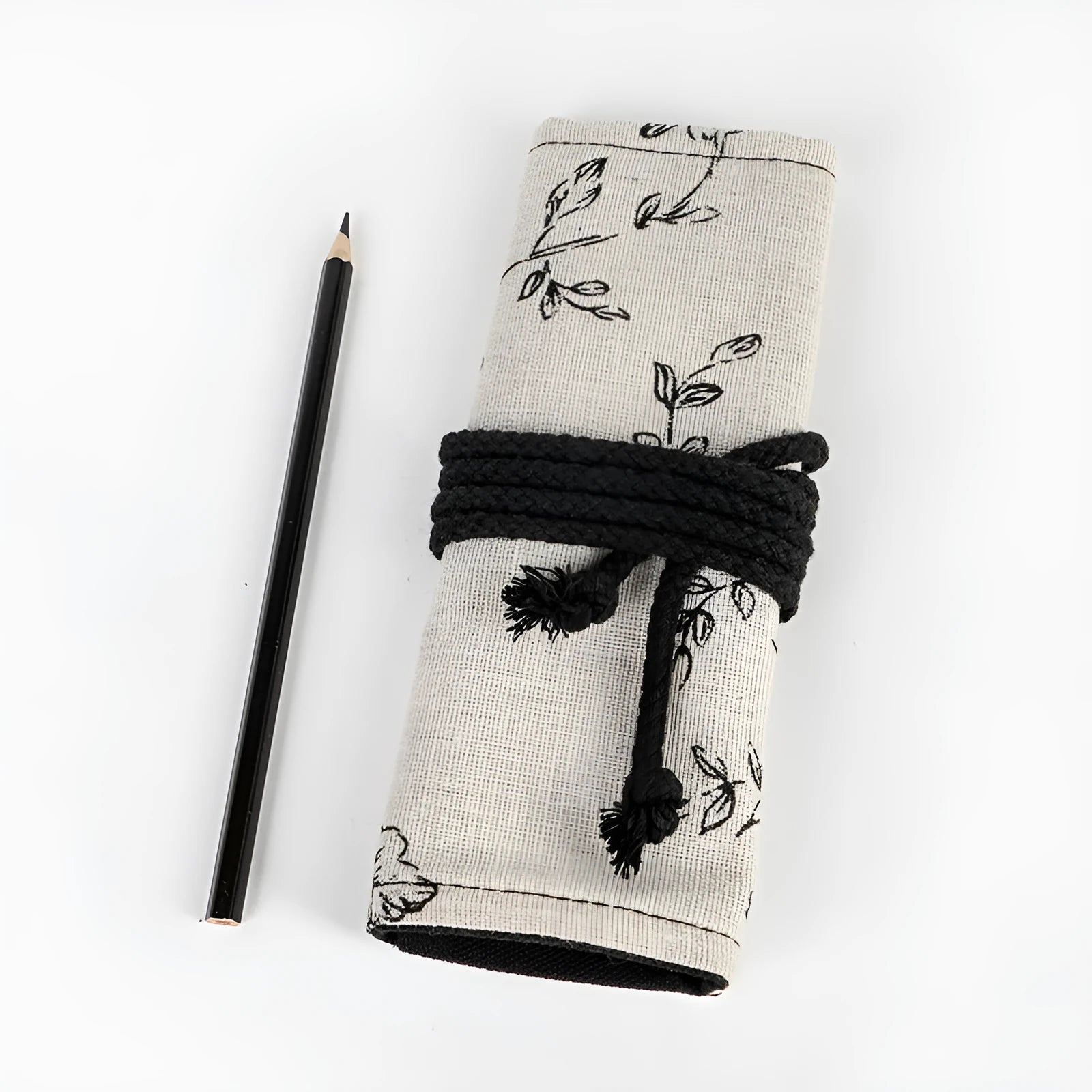 Black Peony floral print canvas pencil roll bag unrolled showing 24 or 72 holes for pencils.
