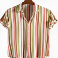 Man wearing colourful digitally printed short sleeved summer shirt in abstract patterns