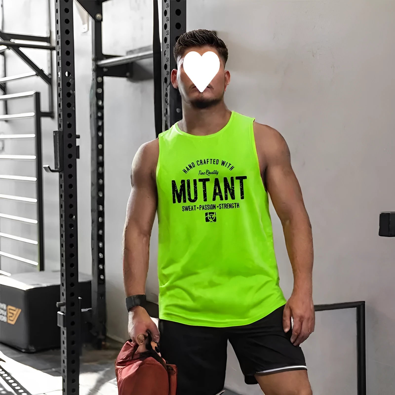 Man's loose-fitting sleeveless polyester fitness vest in a solid colour, showing tank-top design.