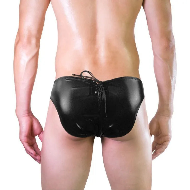 Men's black imitation leather string briefs laid flat showing stretchy waistband