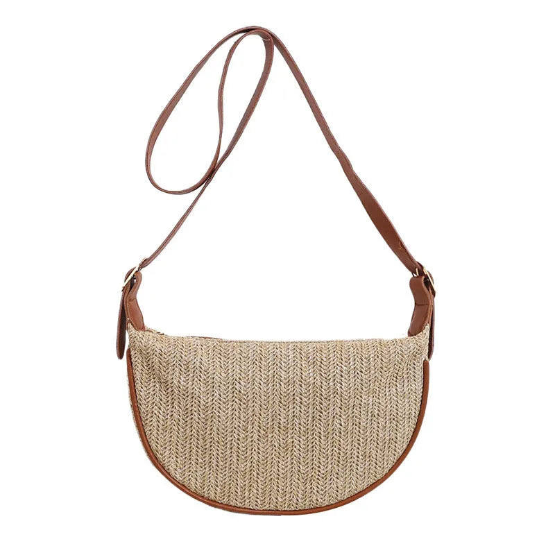 Women's woven straw crossbody bag showing knitted pattern and internal organisation compartments