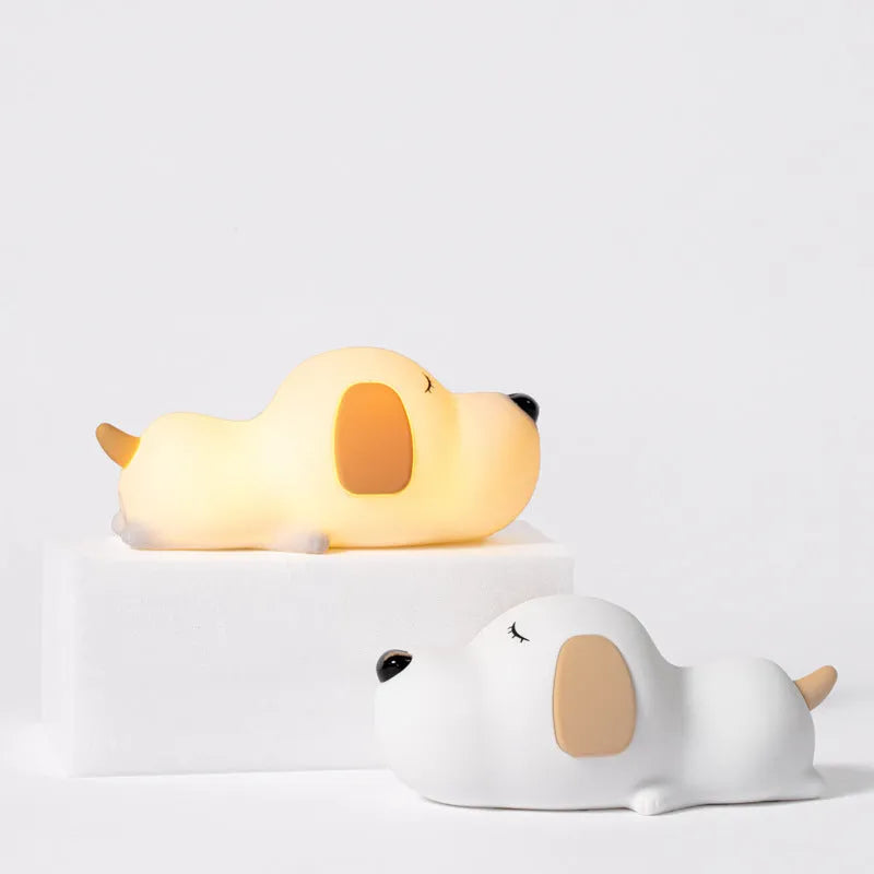 A two-tone cartoon dog-shaped silicone night lamp with a USB charging port.