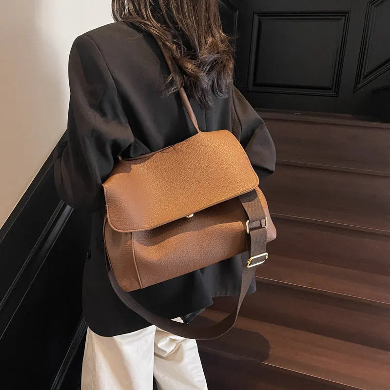 Vintage style square tote bag in PU leather-look material with visible stitching detail.