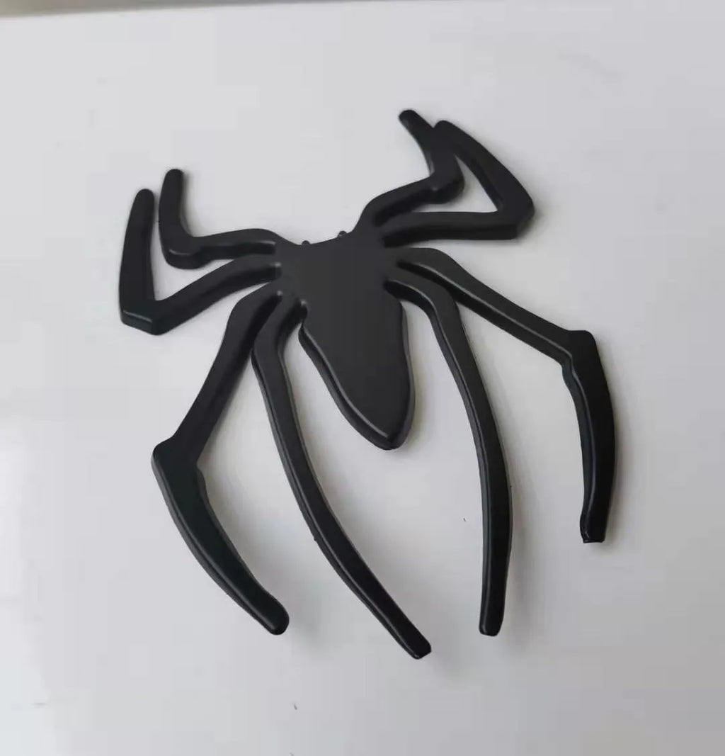 Gold zinc alloy metal bumper sticker with 3D embossed spider design
