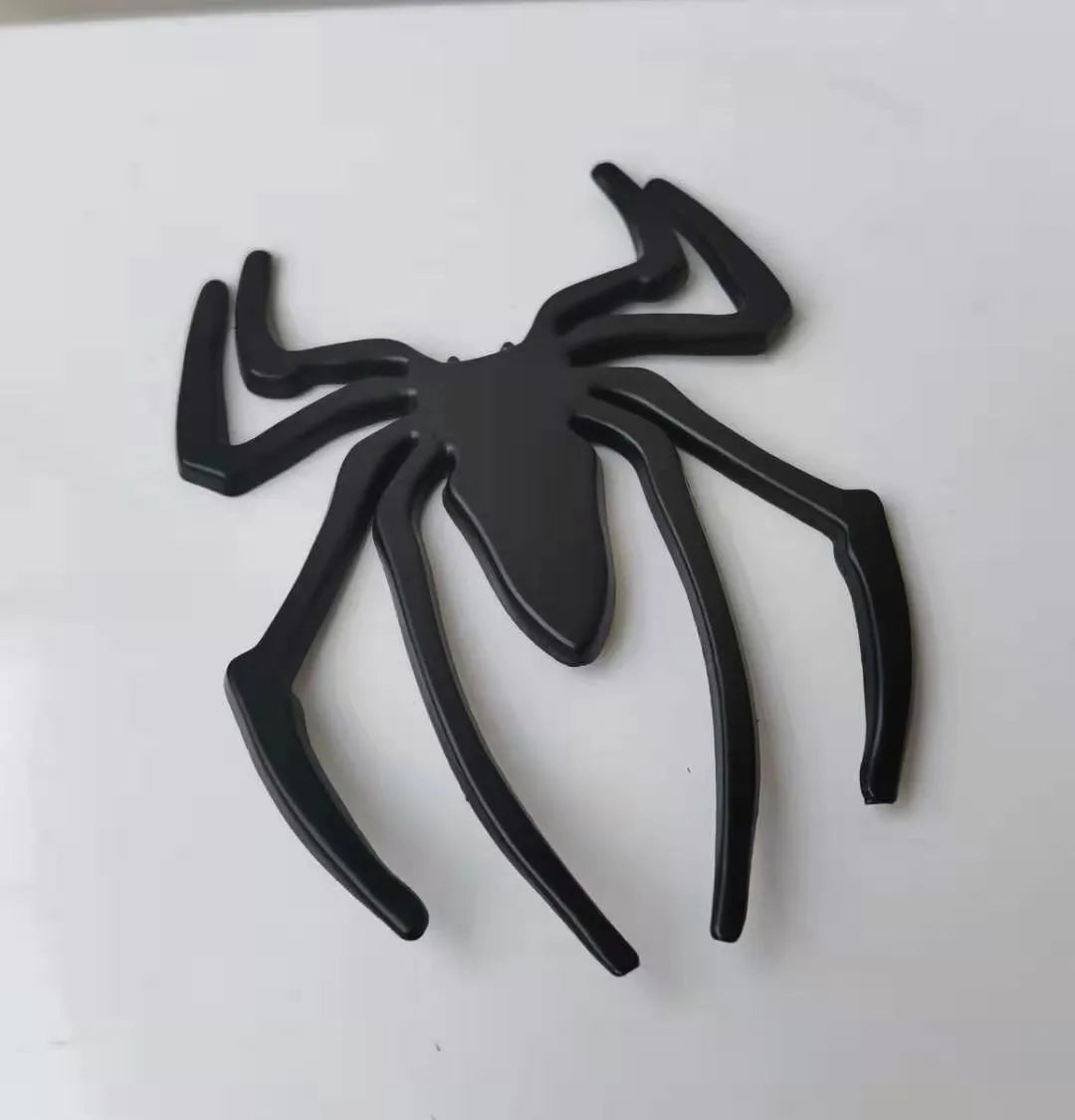 Gold zinc alloy metal bumper sticker with 3D embossed spider design