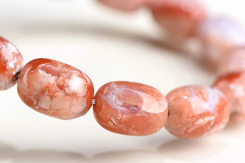 Natural cherry blossom colour agate barrel bead bracelet with Ruyi design elements
