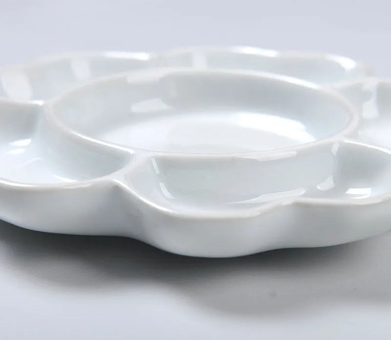 White ceramic painting palette with plum blossom design, shown in 6 inch, 7 inch, and 8 inch size options.