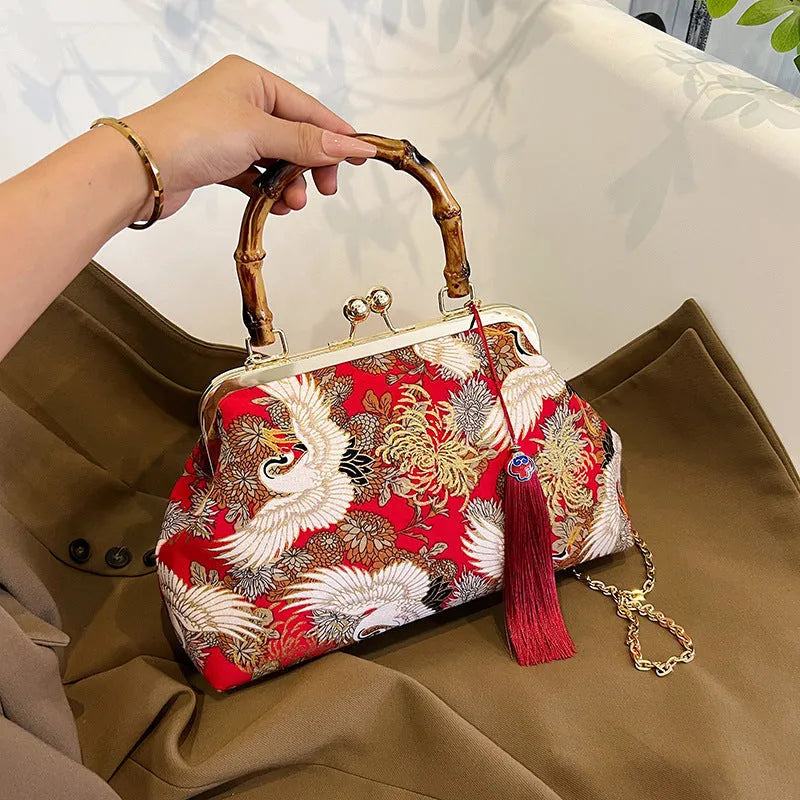 Canvas shell shape crossbody bag with ethnic embroidery, 27cm x 17cm x 7cm, available in black