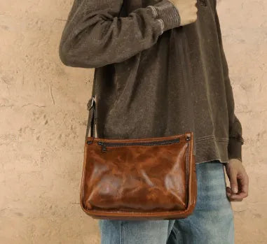 Brown genuine leather men's crossbody messenger bag with large capacity for daily wear