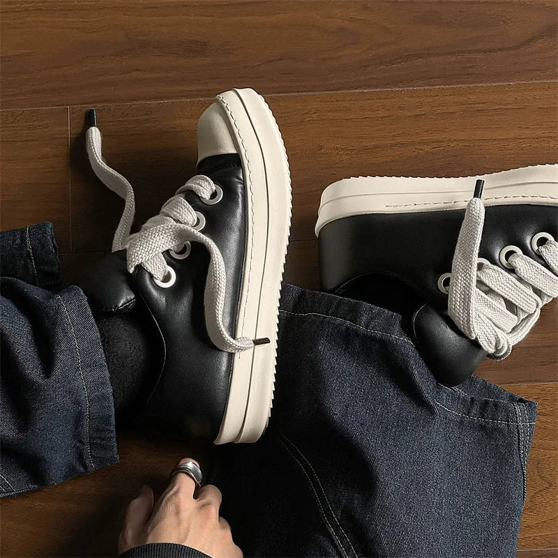 Men's black leather slip-on casual shoes with flat rubber sole and round toe on a white background.