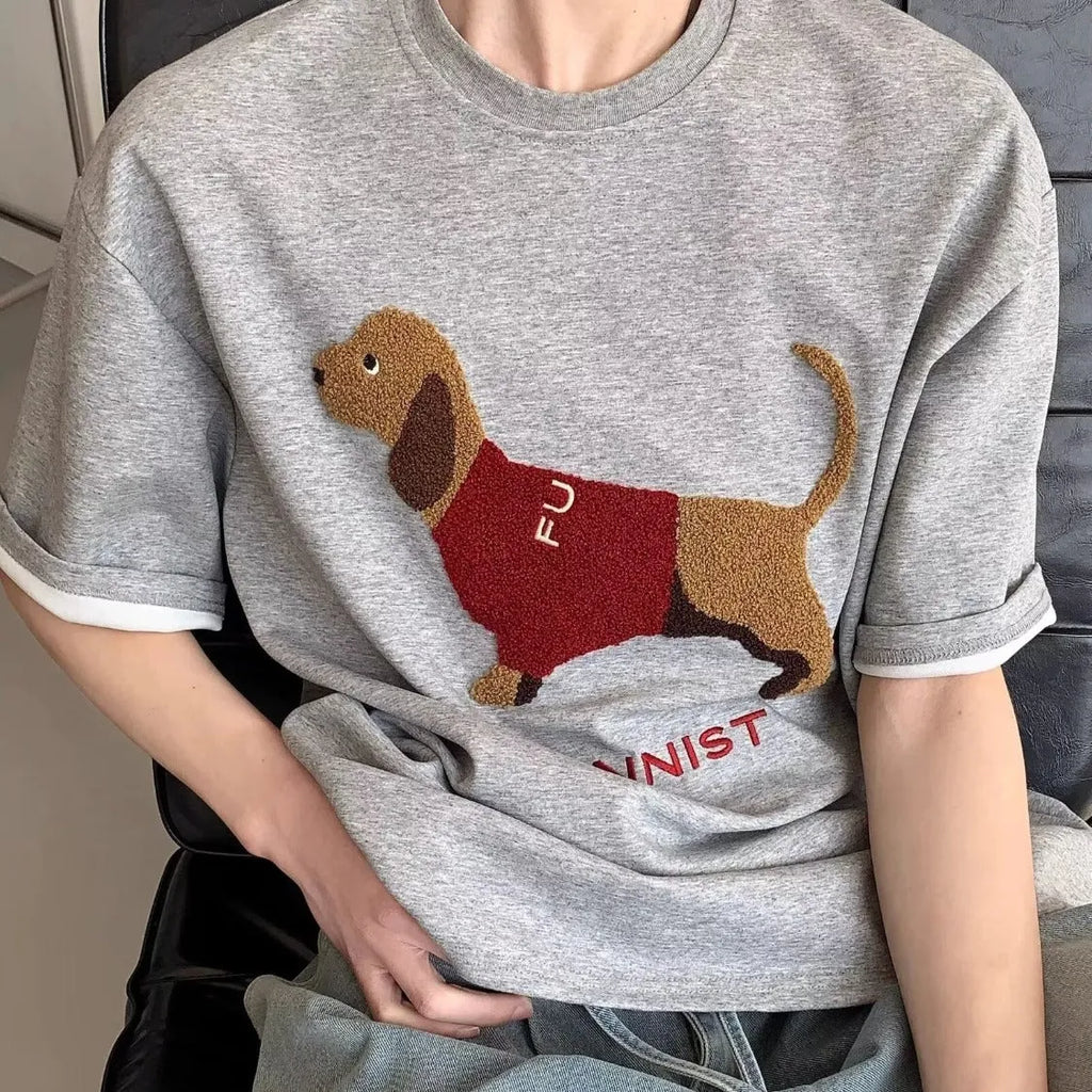 Grey cotton T-shirt for men with an embroidered sausage dog design on the chest.