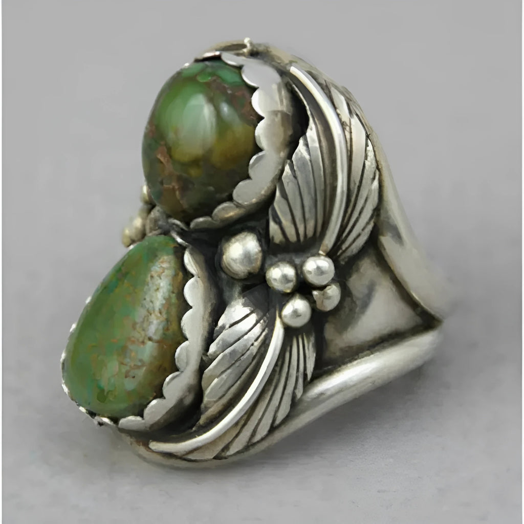 Turquoise geometric retro-style alloy ring for women on a ring stand.