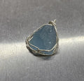 Natural raw aquamarine stone pendant hand-wrapped in gold copper wire with starry sky design
