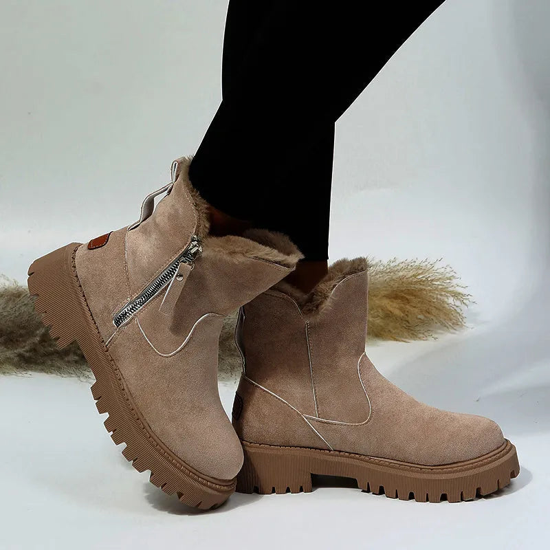 Women's black high-top snow boot with side zip, faux fur lining visible, and a rubber sole.