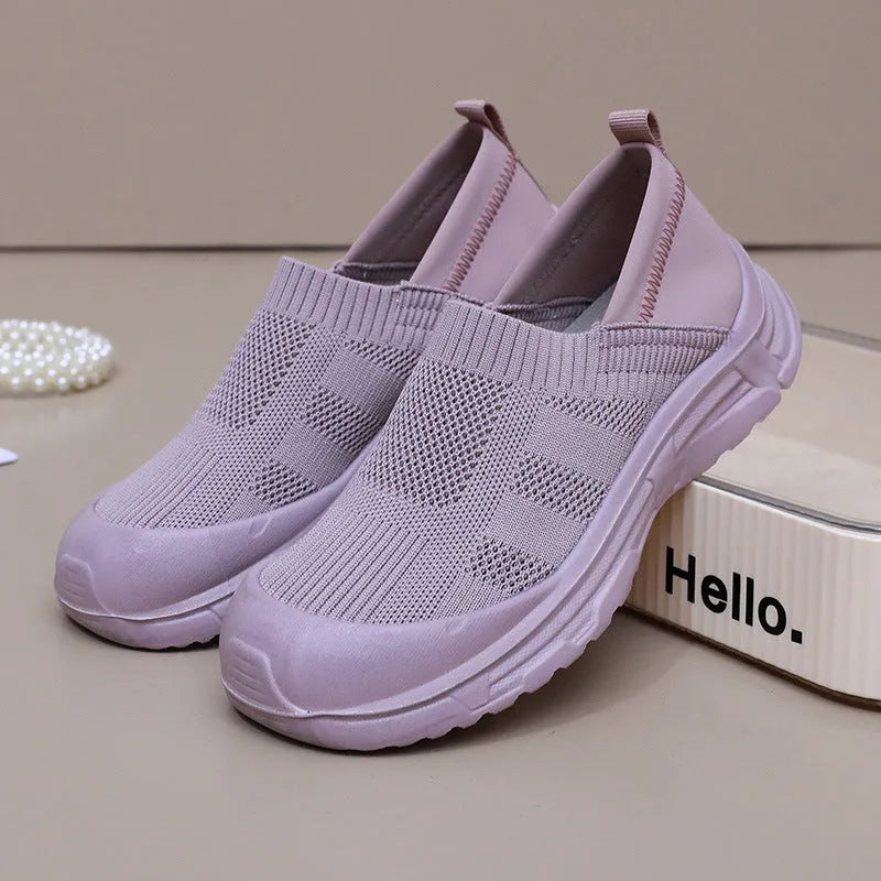 Women's black slip-on shoes with cloth uppers and soft PVC soles