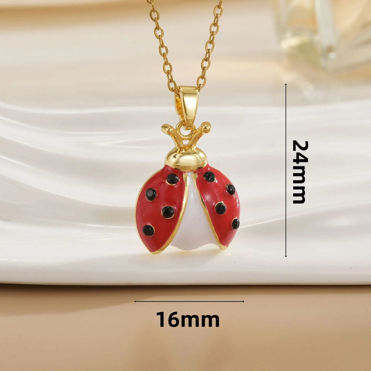 Ladybug pendant necklace with seven-spotted beetle charm, mixed gemstone inlay and copper O-link chain, 41-50cm.
