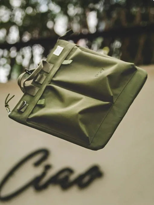 Canvas crossbody messenger bag in retro style showing military green colour with shoulder strap