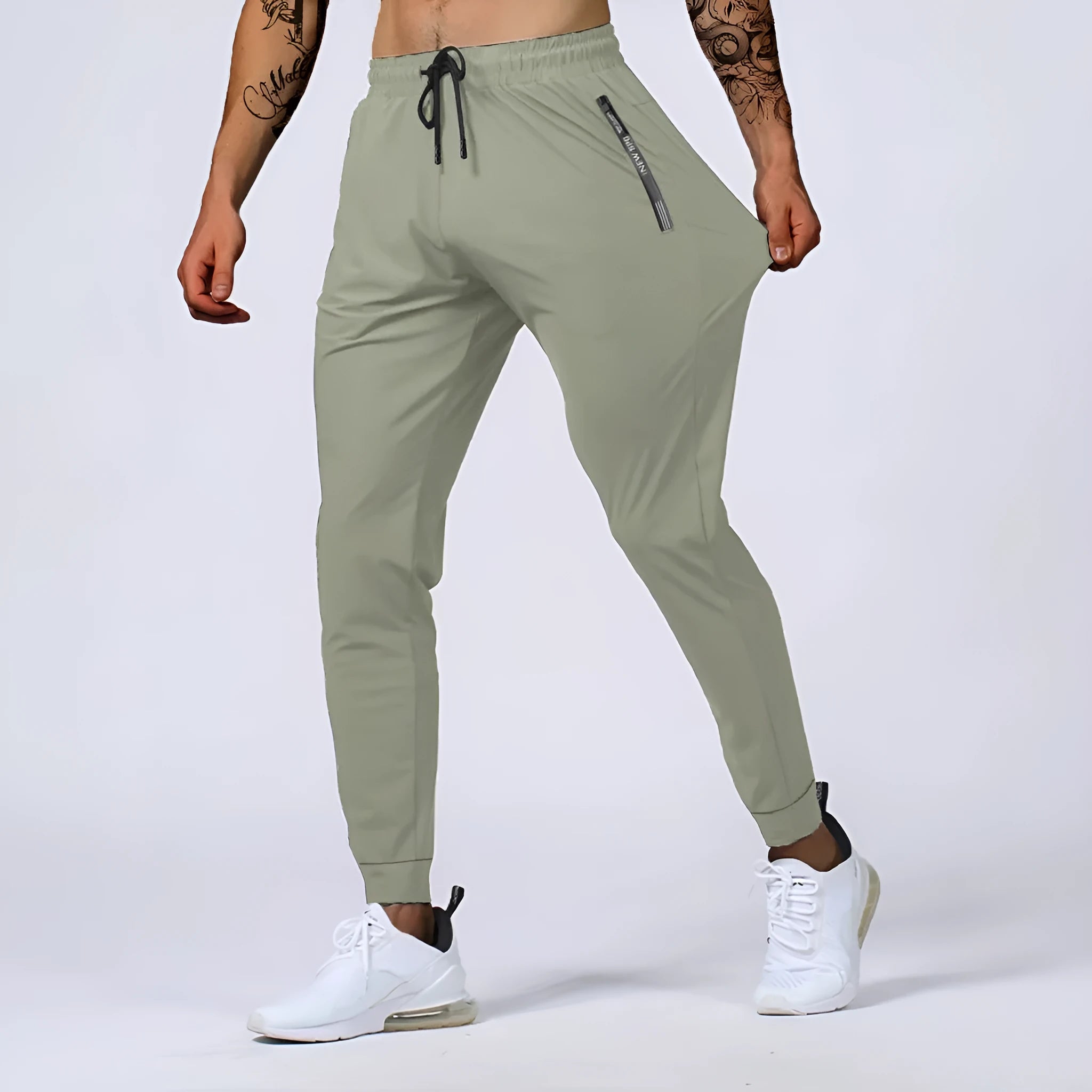 Men's jogging sports pants in nylon blend, mid waist loose fit, available in black gray khaki blue sizes L to 7XL