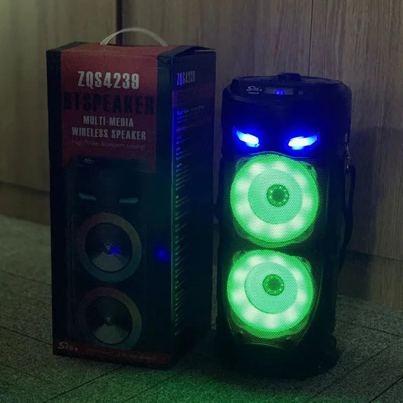 Black portable Bluetooth speaker with dual horn cannon design showing front panel with controls