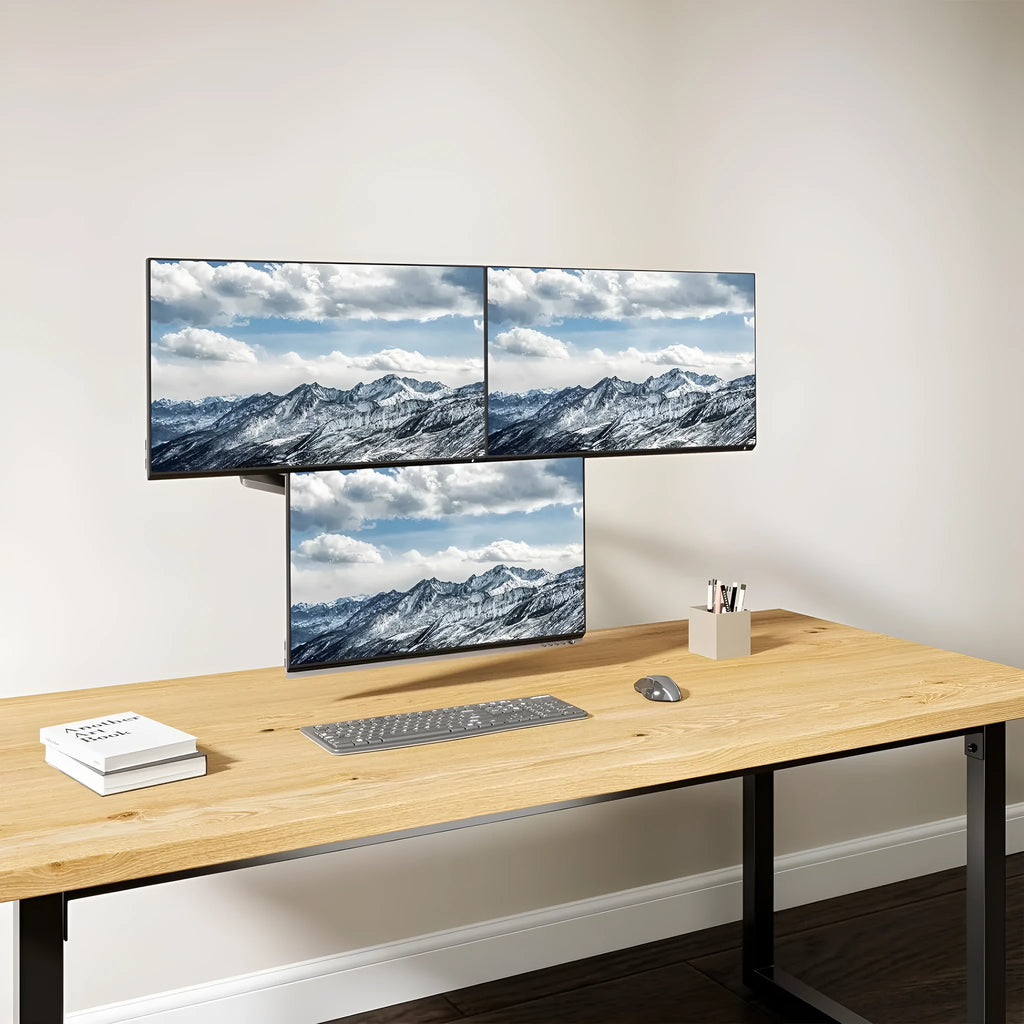 Black three-arm gas spring monitor mounting arm for computer screens up to 27 inches.