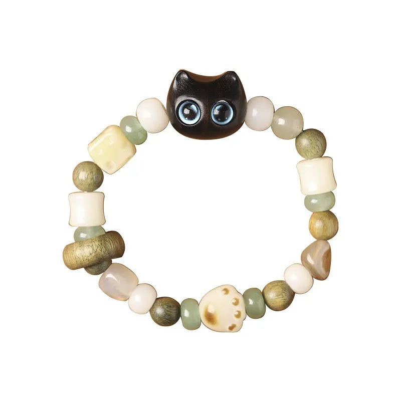 Hand-woven beaded bracelet with jade, bodhi and wood cubes and a wooden Sugar Cat's Paw charm.