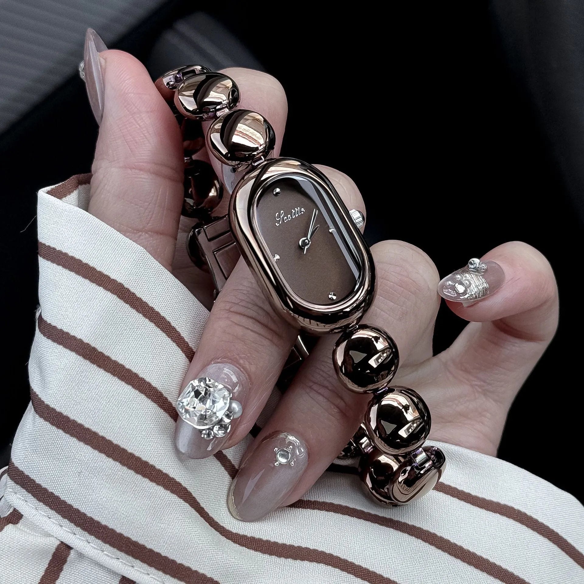 Women's oval dial watch with bracelet strap in multiple colour finishes including gold and platinum options