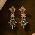 Gold geometric retro stud earrings with round shape and diamond treatment surface