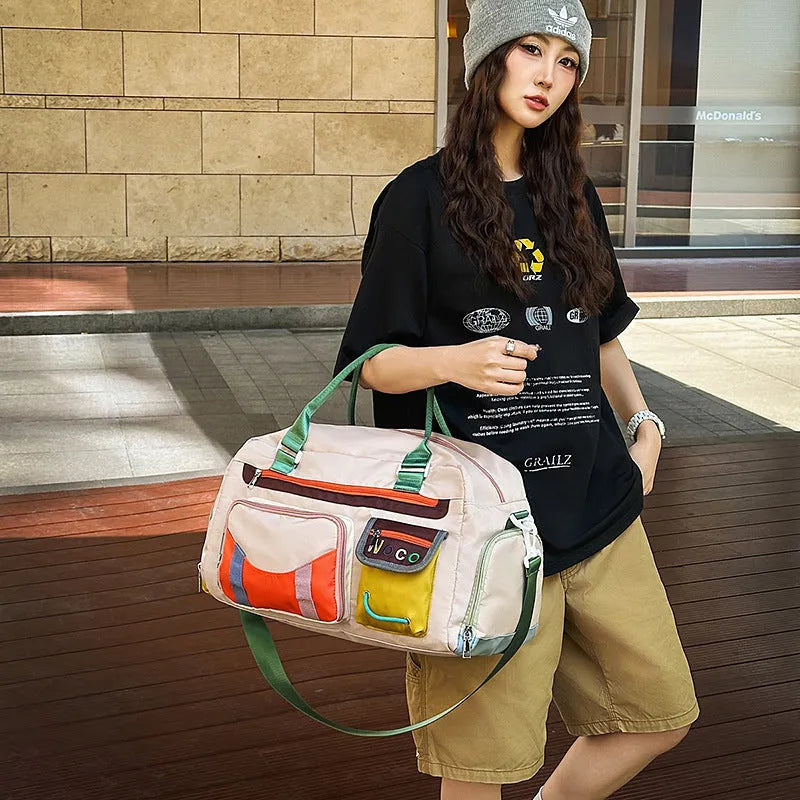 Large black sports messenger bag with shoulder strap showing spacious interior and Oxford cloth construction