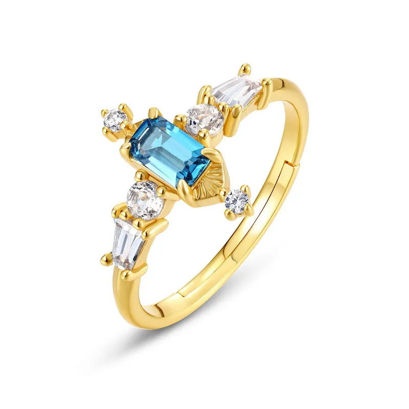 S925 sterling silver adjustable ring with London blue topaz colour, 10K gold electroplated finish, and geometric quadrilateral shape