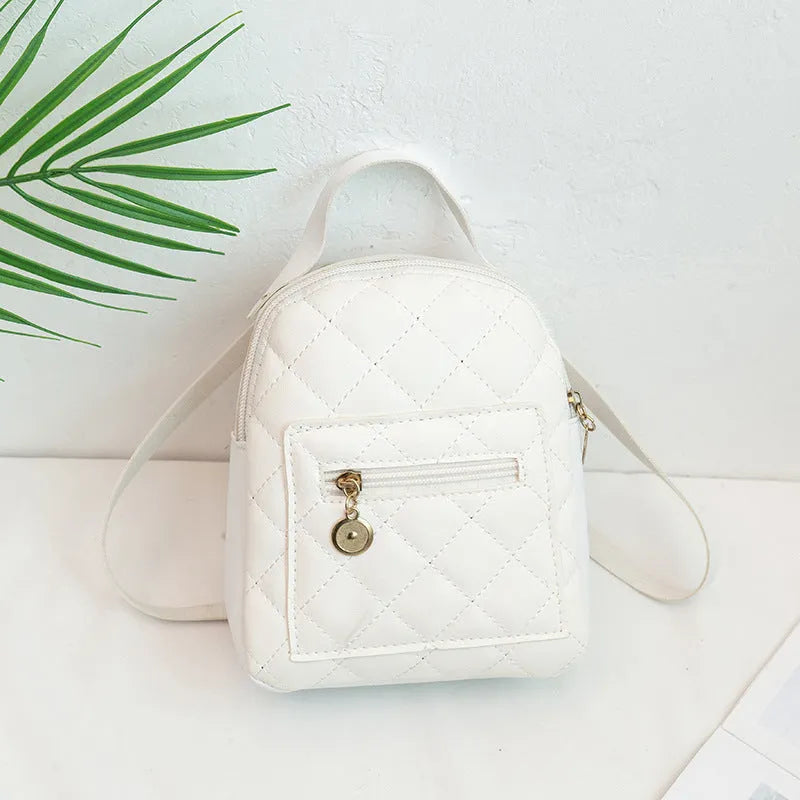 Hard Korean-style backpack with embroidery detail measuring 16x7x19cm in pink colour