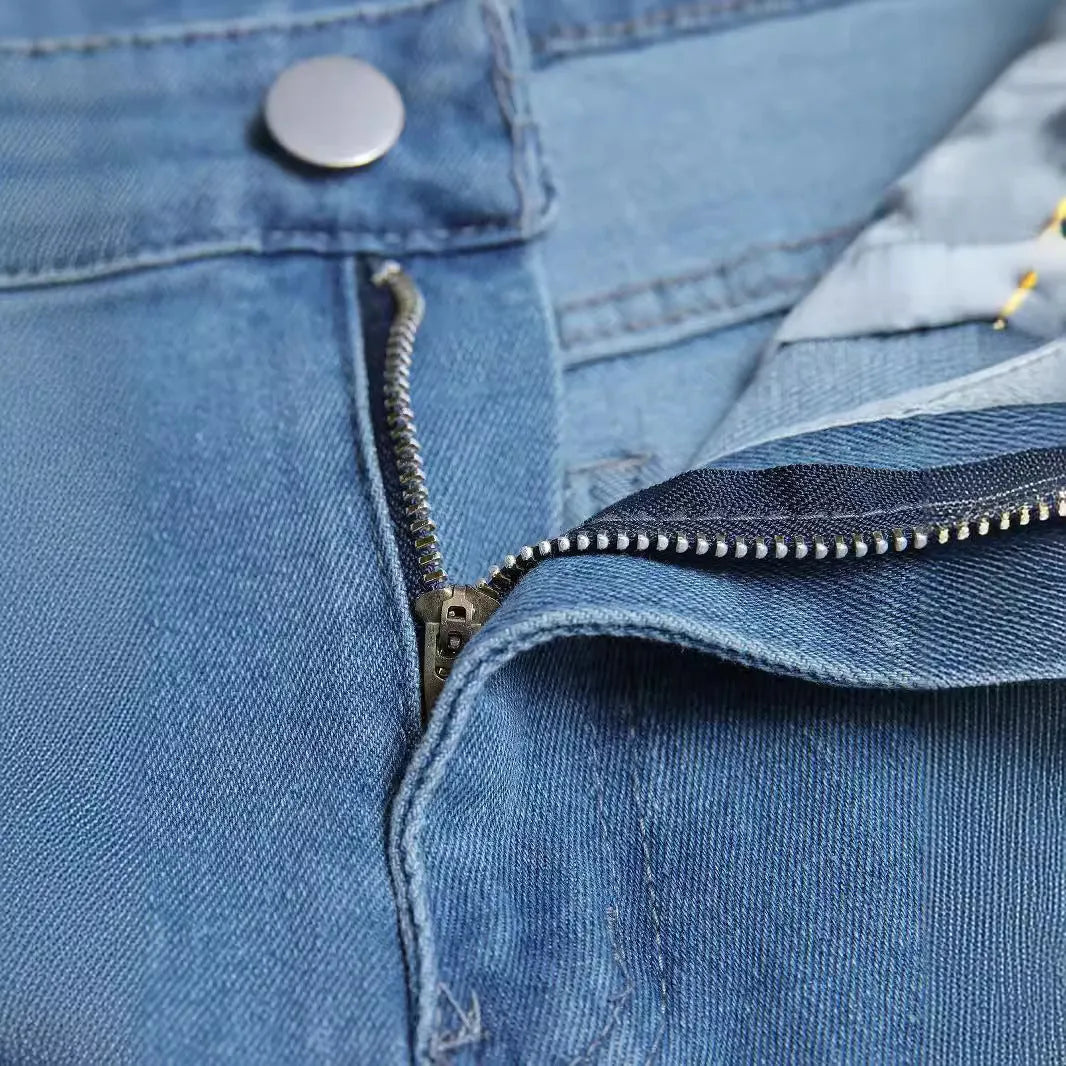 Men's blue denim skinny jeans with medium stretch, cotton fabric, side view on mannequin