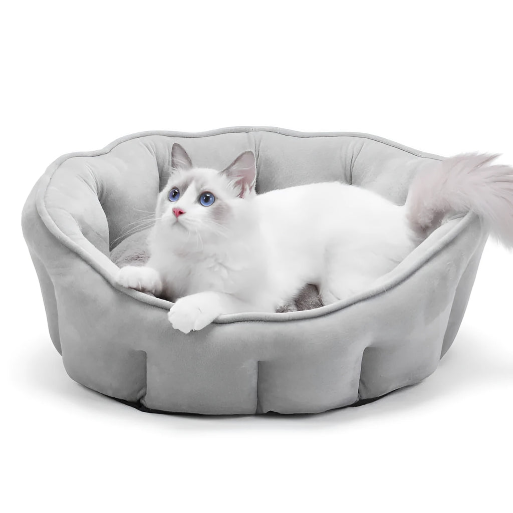 Grey plush cat kennel mat showing enclosed design with raised sides and soft interior.