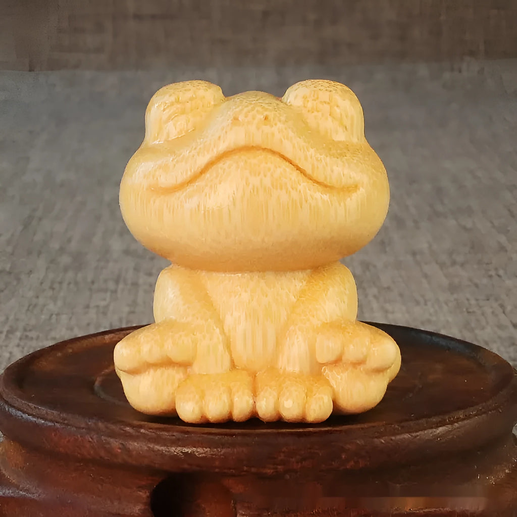 Solid bamboo smiling frog carving ornament measuring 5cm high with 120ml oil glove brush.