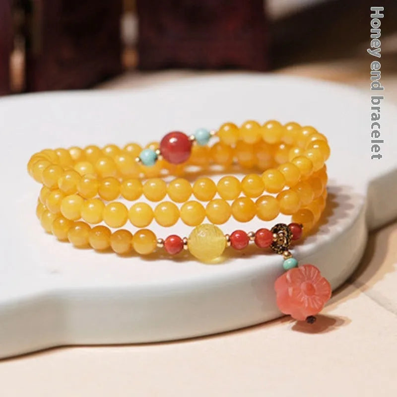 Amber bracelet with carved chicken zodiac charm and 5mm round fantasy crystal elements in retro style