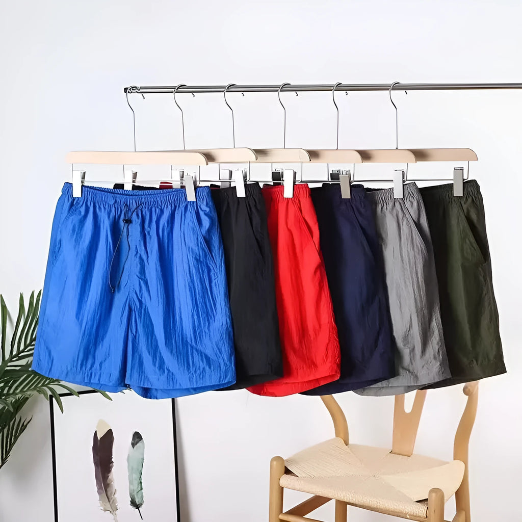 Men's straight-leg quick-dry sports shorts in grey on a hanger