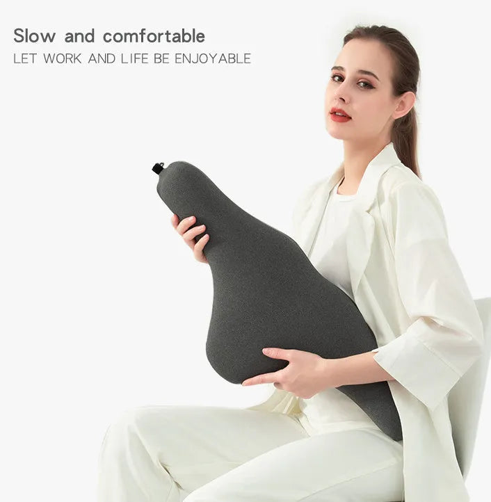 Dark grey car neck memory pillow on a headrest showing its simple rectangular shape.
