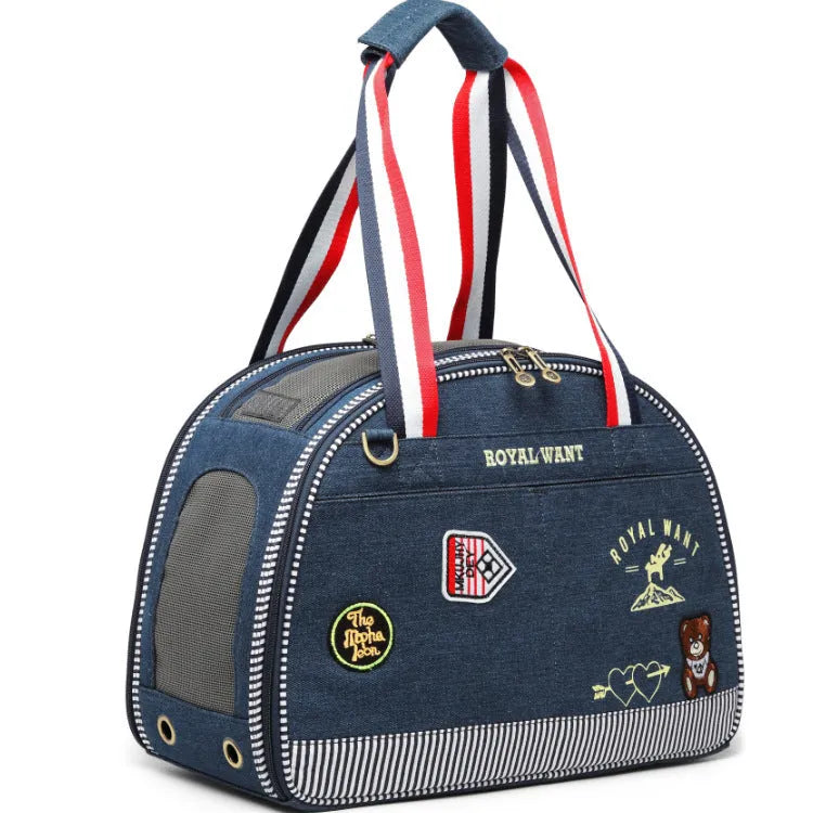Blue denim pet diaper bag with cartoon patterns measuring 43cm by 20cm by 30cm