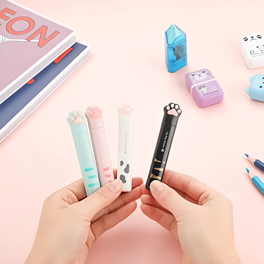 Small folding cat paw mini scissors with stainless steel blade in pink, white, black, and blue colour options.