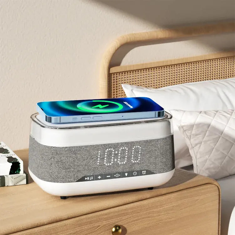 White multifunctional alarm clock with Bluetooth speaker, wireless charging pad, and ambient night light.