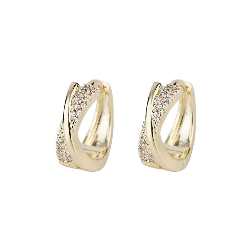 Geometry-shaped copper earrings with zircon treatment in 14K yellow colour