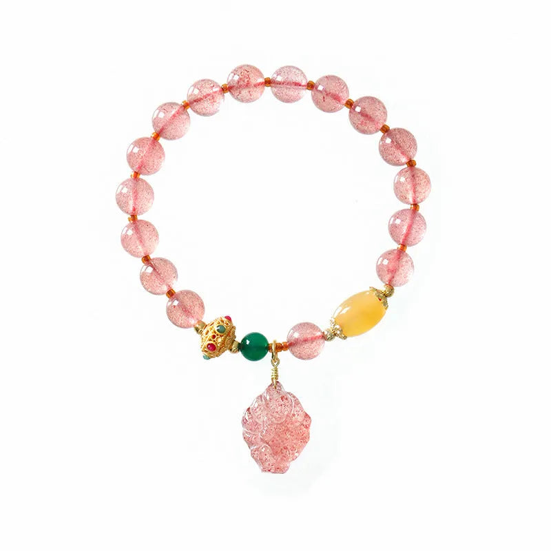 Polished crystal strawberry quartz beaded bracelet in a Nine Tail Fox style for women.
