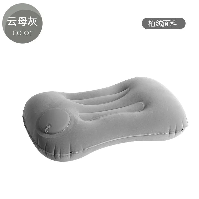 Inflatable travel pillow in flocked gray, navy blue, peacock green or pink colour measuring 45x30x13cm