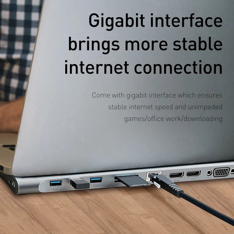 Grey aluminium docking station with cooling bracket showing ten ports including HDMI VGA and network connections