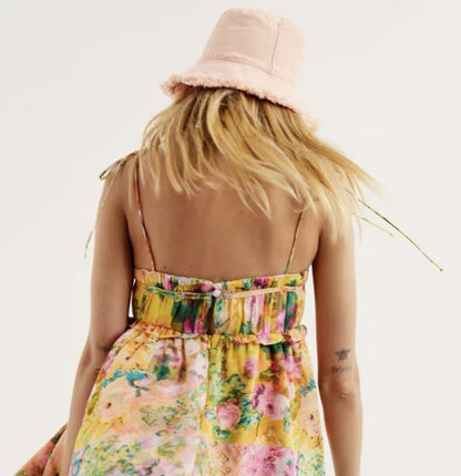 Elegant floral suspender dress with ruffled design, perfect for summer fashion