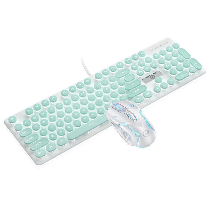 Punk style luminous keyboard in mint green with white backlit keys on a desk.