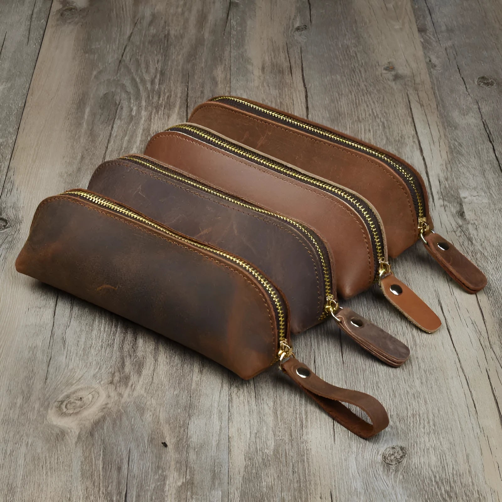 Square handmade cowhide leather pencil case with zipper in black, brown, dark brown, or yellow.