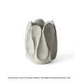 Irregular ceramic art vase in magnesium clay material showing textured finish and distinctive handmade shape