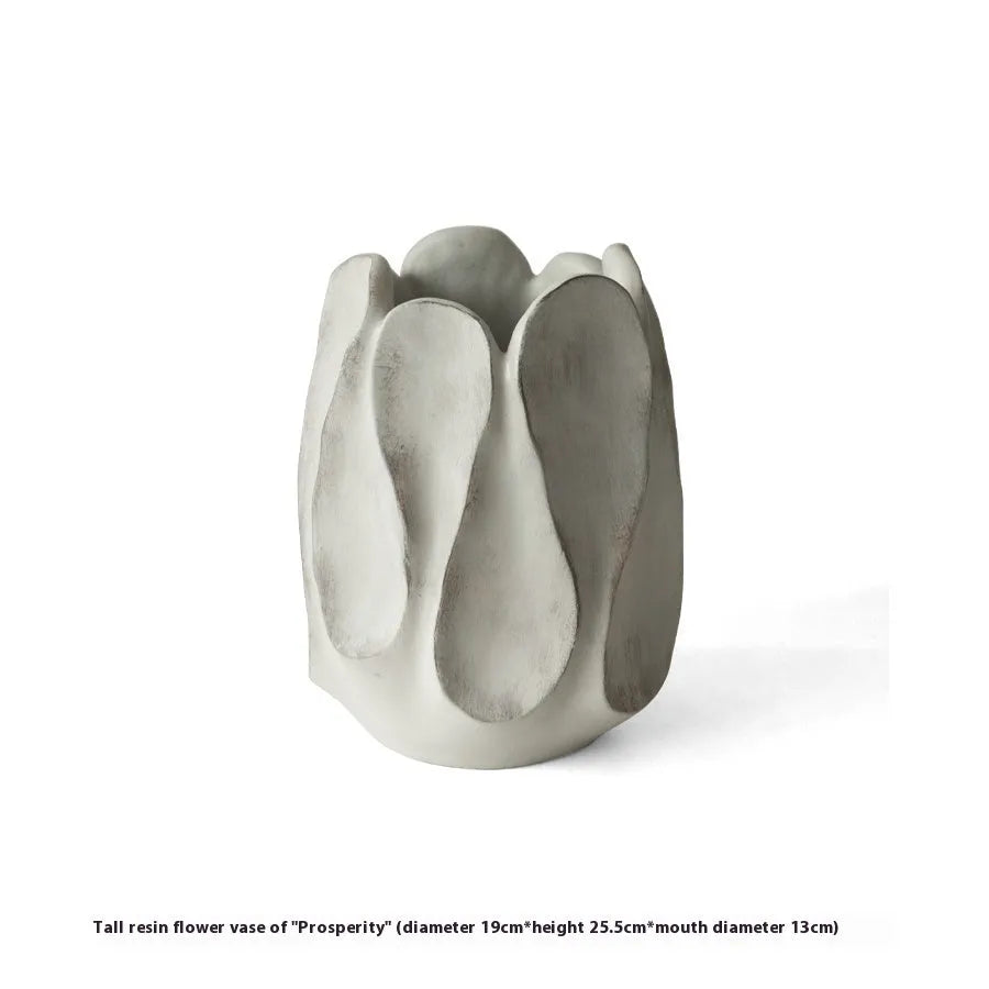 Irregular ceramic art vase in magnesium clay material showing textured finish and distinctive handmade shape