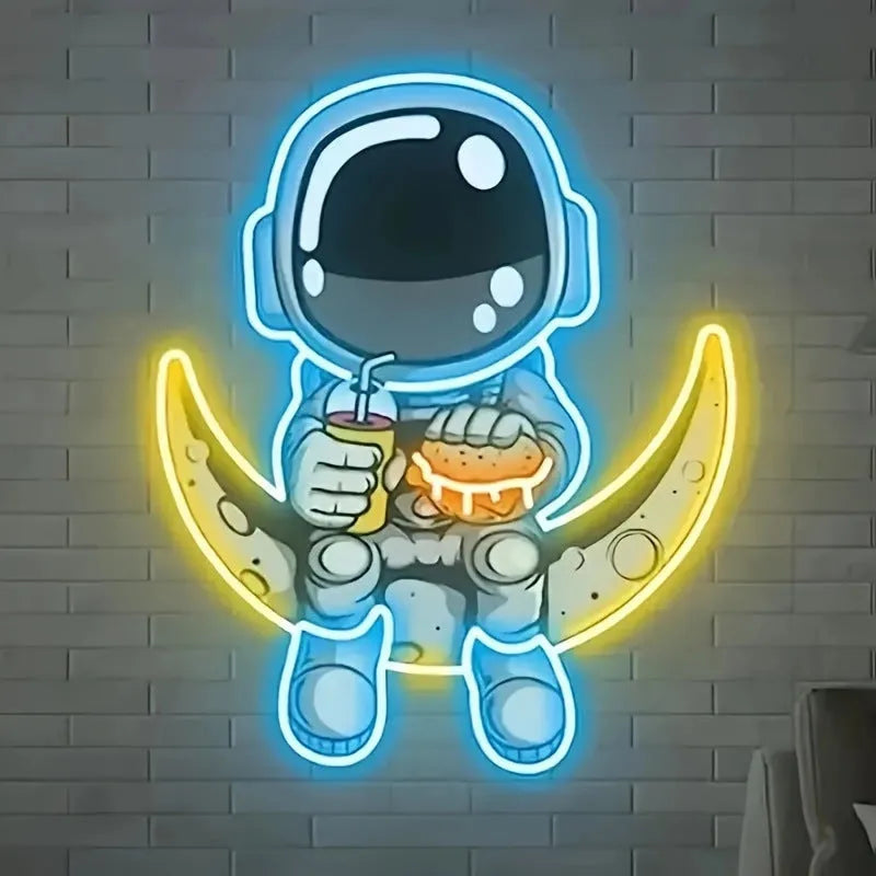 Blue and yellow astronaut and moon LED neon light mounted on a wall.