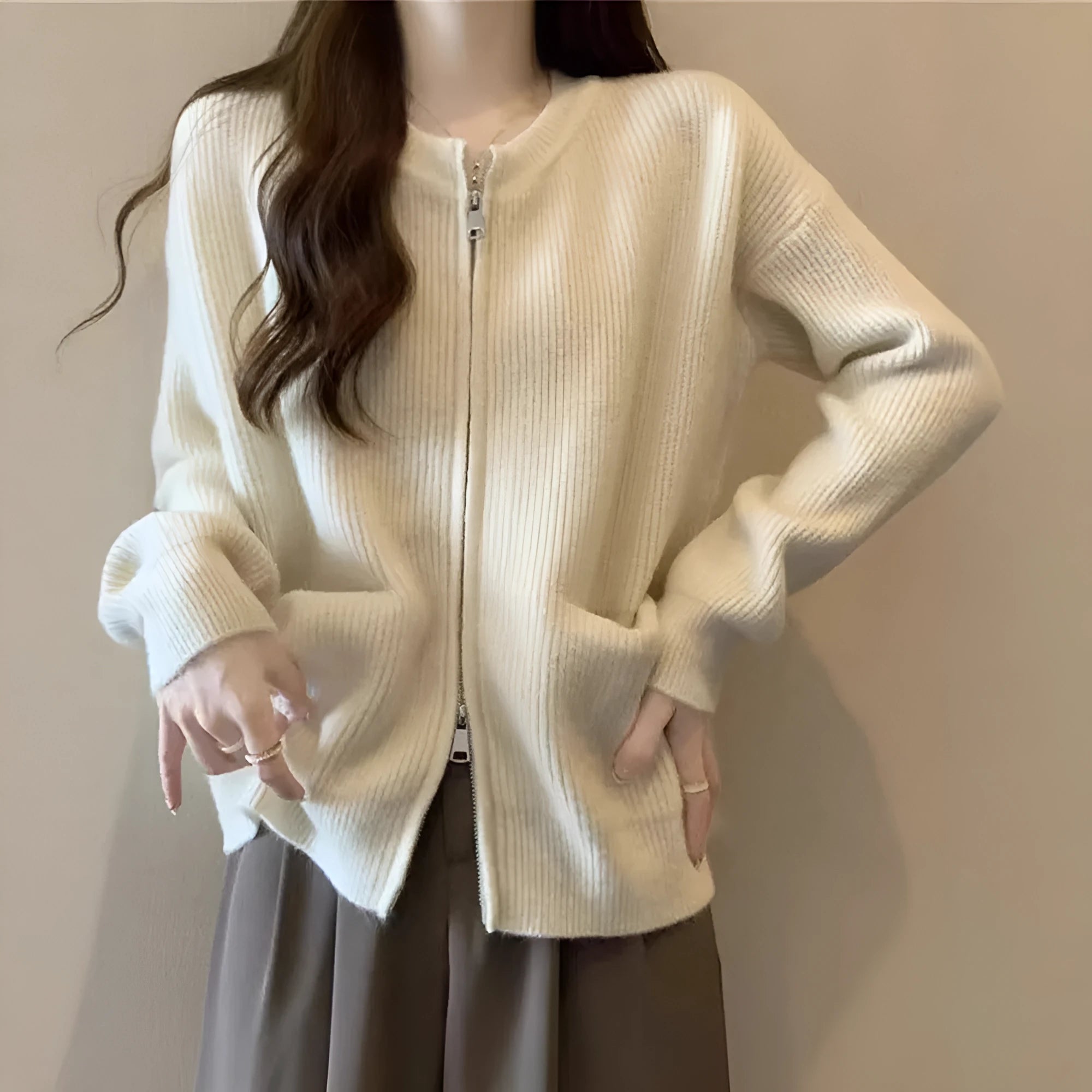 Beige long sleeve cardigan-style sweater coat made from soft viscose fibre fabric.